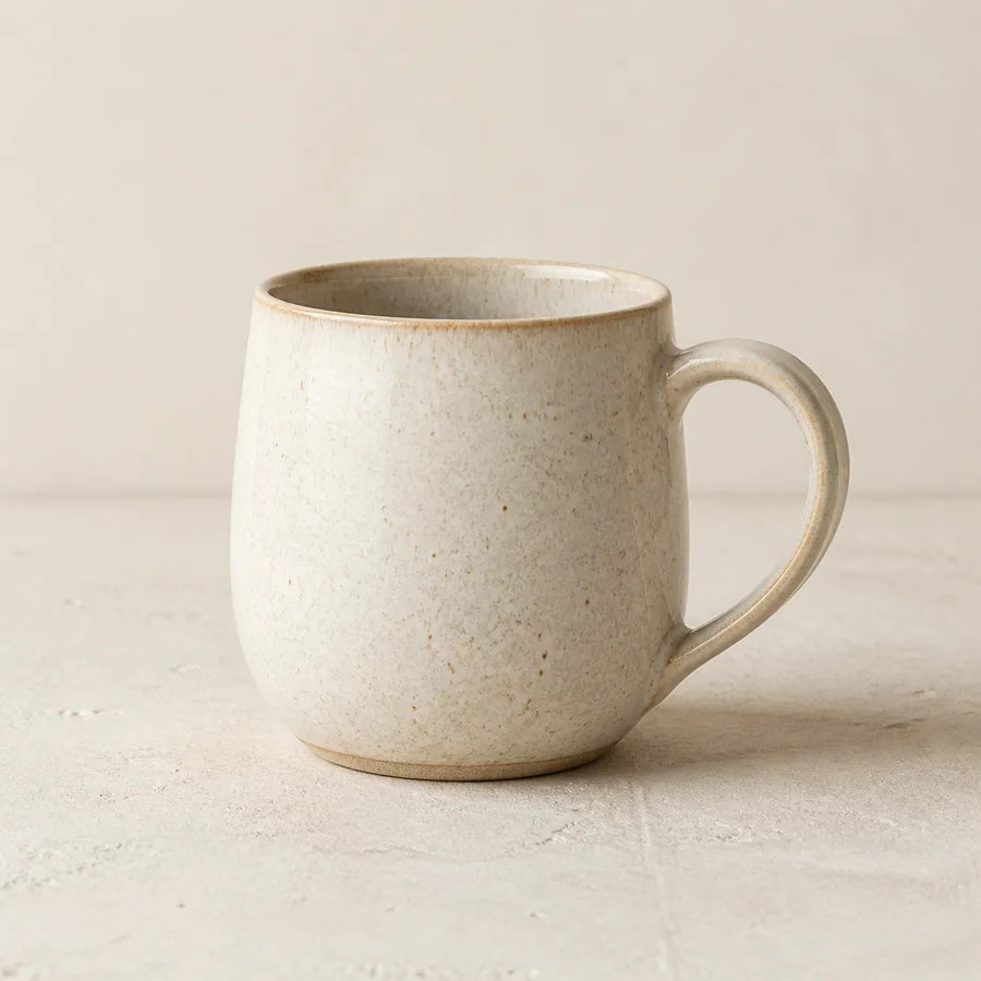Handmade ceramic mug viewed from the right